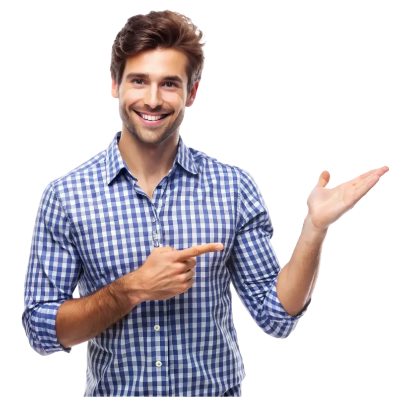 Hombre sonriente con casima a cuadros señalando algo que se encuentra a su izquierda.